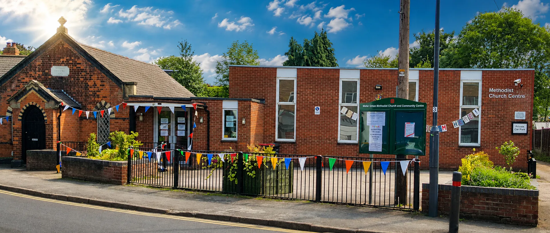 The exterior of Water Orton Methodist Church, decorated with bunting